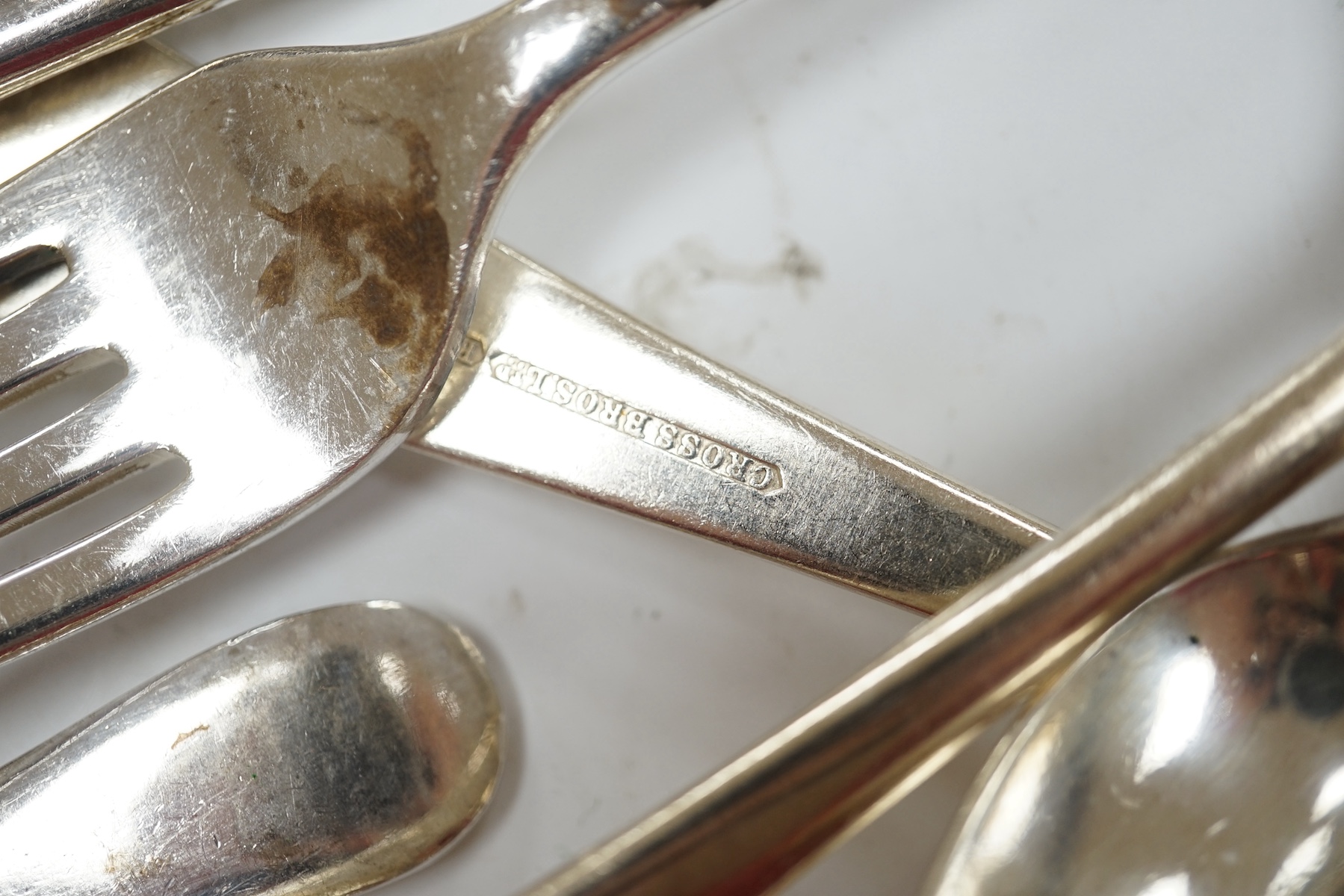 A William IV provincial silver fiddle pattern sauce ladle, John Langdon, Exeter, 1833, together with a set of six later silver coffee spoons, 4.9oz, together with a quantity of assorted plated flatware. Condition - fair